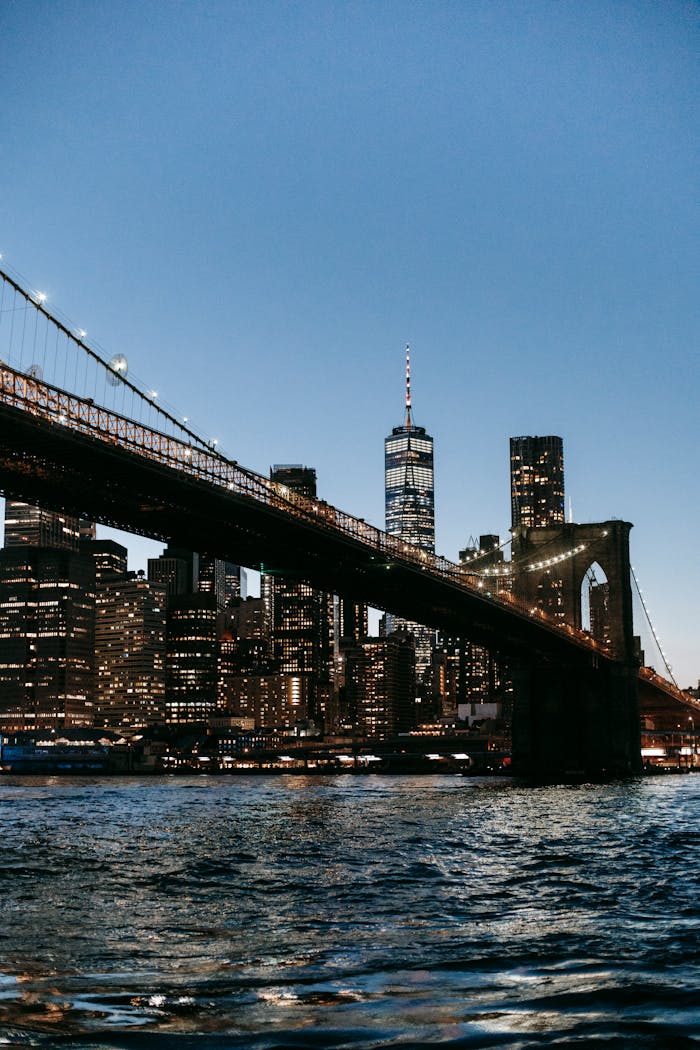 Suspension bridge over river at night